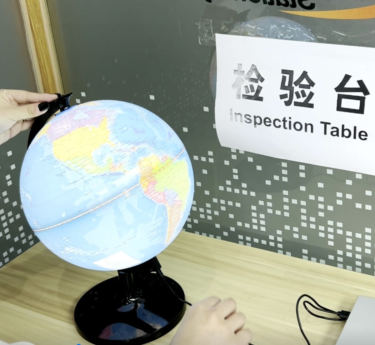 Lighting test of an illuminated globe at the inspection table